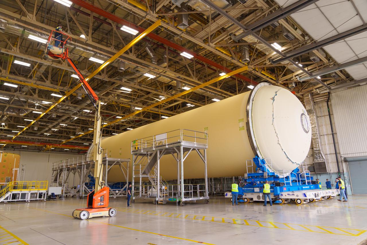 Teams at NASA’s Michoud Assembly Facility in New Orleans move a liquid hydrogen tank for the agency’s SLS (Space Launch System) rocket into the factory’s final assembly area on April 22. Having recently completed application of the thermal protection system, teams will now continue outfitting the 130-foot-tall tank with critical systems to ready it for its designated Artemis III mission. The propellant tank is one of five major elements that make up the 212-foot-tall rocket stage. The core stage, along with its four RS-25 engines, produce more than two million pounds of thrust to help launch NASA’s Orion spacecraft, astronauts, and supplies beyond Earth’s orbit and to the lunar surface for Artemis.